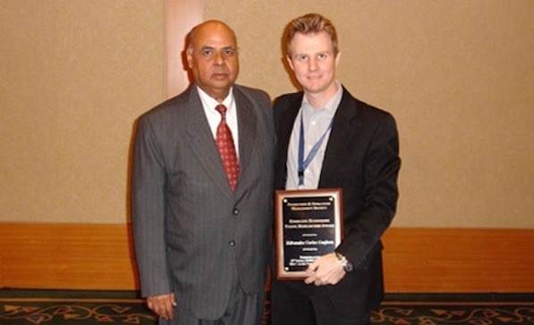 Edivandro Conforto receiving the POMS EEYRA award, Vancouver, 2010